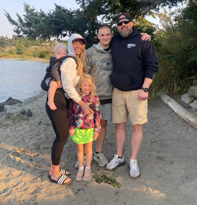 Eric Blosfield with his wife and children on a Puget Sound beach